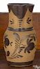 Western Pennsylvania tanware pitcher, 19th c., with Albany slip tulip decoration, 9 1/2'' h.