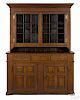 Pennsylvania walnut two-part Dutch cupboard, ca. 1790, with a boldly molded cornice and base
