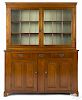 Pennsylvania walnut two-part Dutch cupboard, ca. 1800, with a raised panel base, 80 3/4'' h.