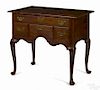 New England Queen Anne cherry dressing table, ca. 1765, with four drawers and cabriole legs