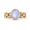 A STAR SAPPHIRE CHAIN LINK RING in 18ct yellow gold, set with a cabochon star sapphire of approxi...