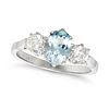 AN AQUAMARINE AND DIAMOND THREE STONE RING in platinum, set with an oval cut aquamarine of approx...