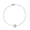 A DIAMOND BRACELET in 18ct white gold, comprising a stylised star motif set with round brilliant ...