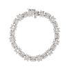 A DIAMOND BRACELET in 14ct white gold, comprising twelve floral clusters, set with round brillian...