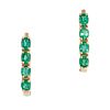 A PAIR OF EMERALD HOOP EARRINGS in 18ct yellow gold, each set with a row of four oval cut emerald...