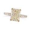 A YELLOW DIAMOND DRESS RING in 18ct yellow gold, set with a radiant cut diamond of 4.04 carats ac...