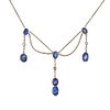A SAPPHIRE AND DIAMOND FRINGE NECKLACE in platinum, comprising a trace chain set with oval cut sa...