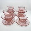Seven Pink depression glass style cups and saucers