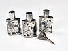 THREE SMALL STERLING OVERLAY PERFUME BOTTLES WITH FUNNEL 