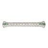 A DIAMOND AND EMERALD BAR BROOCH in platinum, set with a row of old cut diamonds accented by cali...