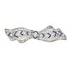 A VINTAGE DIAMOND & SYNTHETIC SAPPHIRE BOW BROOCH in platinum, set with a central old cut diamond...