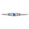 A SAPPHIRE AND DIAMOND BAR BROOCH in platinum, set to the centre with a round cut sapphire of app...