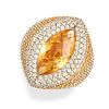 A CITRINE, YELLOW SAPPHIRE AND DIAMOND DRESS RING in yellow gold, set with a marquise shaped face...