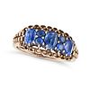 A SAPPHIRE RING in rose gold, set with three cushion cut sapphires punctuated by pairs of round c...