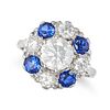 A DIAMOND AND SYNTHETIC SAPPHIRE CLUSTER RING in platinum and 18ct white gold, set with a round b...