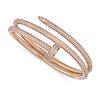 A DIAMOND NAIL BANGLE in 18ct rose gold, designed as a curved nail pave set with round brilliant ...