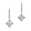 A PAIR OF DIAMOND DROP EARRINGS in 18ct white gold, each comprising a huggie hoop set with round ...