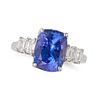 A TANZANITE AND DIAMOND RING in 18ct white gold, set with a cushion cut tanzanite of 3.89 carats ...