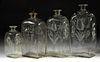 HALF-POST BLOWN AND ENGRAVED CASE BOTTLES, LOT OF FOUR