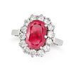 A BURMA NO HEAT RUBY AND DIAMOND CLUSTER RING in 18ct white gold, set with a cushion cut ruby of ...