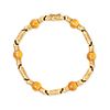 BOUCHERON, A VINTAGE CITRINE BRACELET in 18ct yellow gold, comprising a row of stylised gold link...