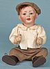 Bisque boy doll, inscribed 152/6, with a compos