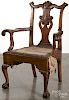 Boldly carved Chippendale style tiger maple armchair with a shell carved crest