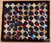 Silk courthouse steps quilt, dated 1887, 73'' x 65''.