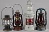 Five painted tin lanterns, to include Embury Little Supreme, two Dietz, and an unmarked example
