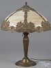 Gilt metal table lamp, early 20th c., with a slag glass shade, 23'' h.