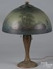 Gilt metal table lamp, early 20th c., with a reverse and obverse painted shade.