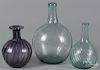 Two blown aqua glass swirl bottles, together with a later amethyst bottle, tallest - 9 3/4''.