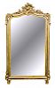 * A Rococo Style Giltwood Mirror Height 63 inches.