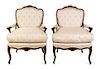 A Pair of Louis XV Style Walnut Fauteuils Height 39 1/2 x width 29 3/4 x depth 21 1/2 inches.