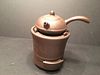 A Fine Chinese Zisha teapot on a Furnace, 5 1/2" wide, 8" high total, teapot 6 1/2" wide, 2 1/2" high