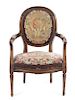 A French Carved Walnut Fauteuil Height 34 1/2 inches.