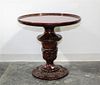 A Neoclassical Style Mahogany Side Table Height 24 x diameter 25 1/2 inches.