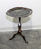 * A Victorian Lacquered Tripod Table Height 22 x width 16 x depth 13 1/4 inches.