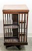 A Walnut Revolving Bookcase. Height 33 x width 18 x depth 18 inches.