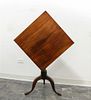 An American Walnut Tilt-top Table Height 47 inches.
