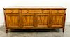 * Baker Furniture, AMERICAN, SECOND HALF 20TH CENTURY, a credenza with four drawers above four cabinet doors