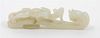 A Pale Celadon Jade Dragon Belt Hook. Length 3 7/8 inches.