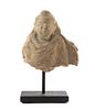* A Small Gandharan Stucco Fragment Height 2 1/2 inches.