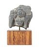 * A Gandharan Gray Schist Stone Fragment Height 2 3/4 inches.