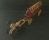  CAST IRON HORSE DRAWN FIRE WAGON WITH DIRVER, 2 LADDERS, 3 HORSES