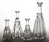 PILLAR-MOLDED GLASS DECANTERS, LOT OF FOUR