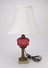Brass and marble lamp with cranberry glass font
