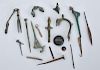 MISCELLANEOUS GROUP OF ANCIENT BRONZE FIBULAE AND METAL FRAGMENTS