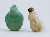 TWO CHINESE CARVED JADE SNUFF BOTTLES AND STOPPERS
