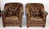Pair of tufted leather armchairs